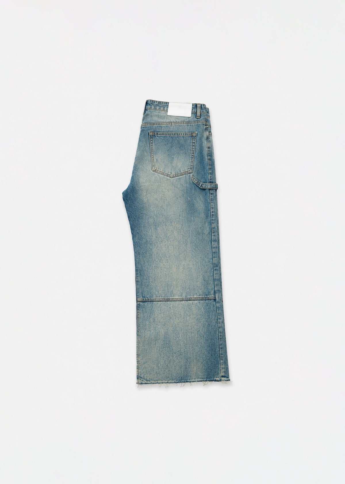 Light-wash carpenter jeans folded side view with tool loop and knee seam