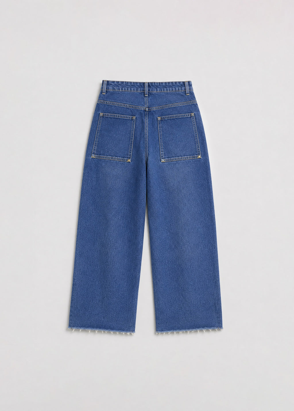 Medium-wash wide-leg jeans back view with oversized riveted pockets