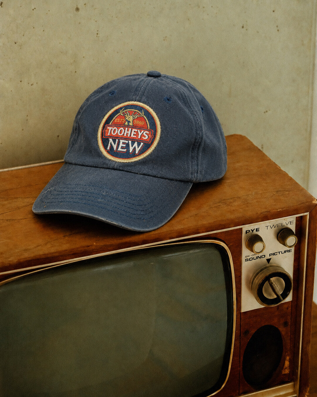 Blue Tooheys New Patch Cap, styled angle