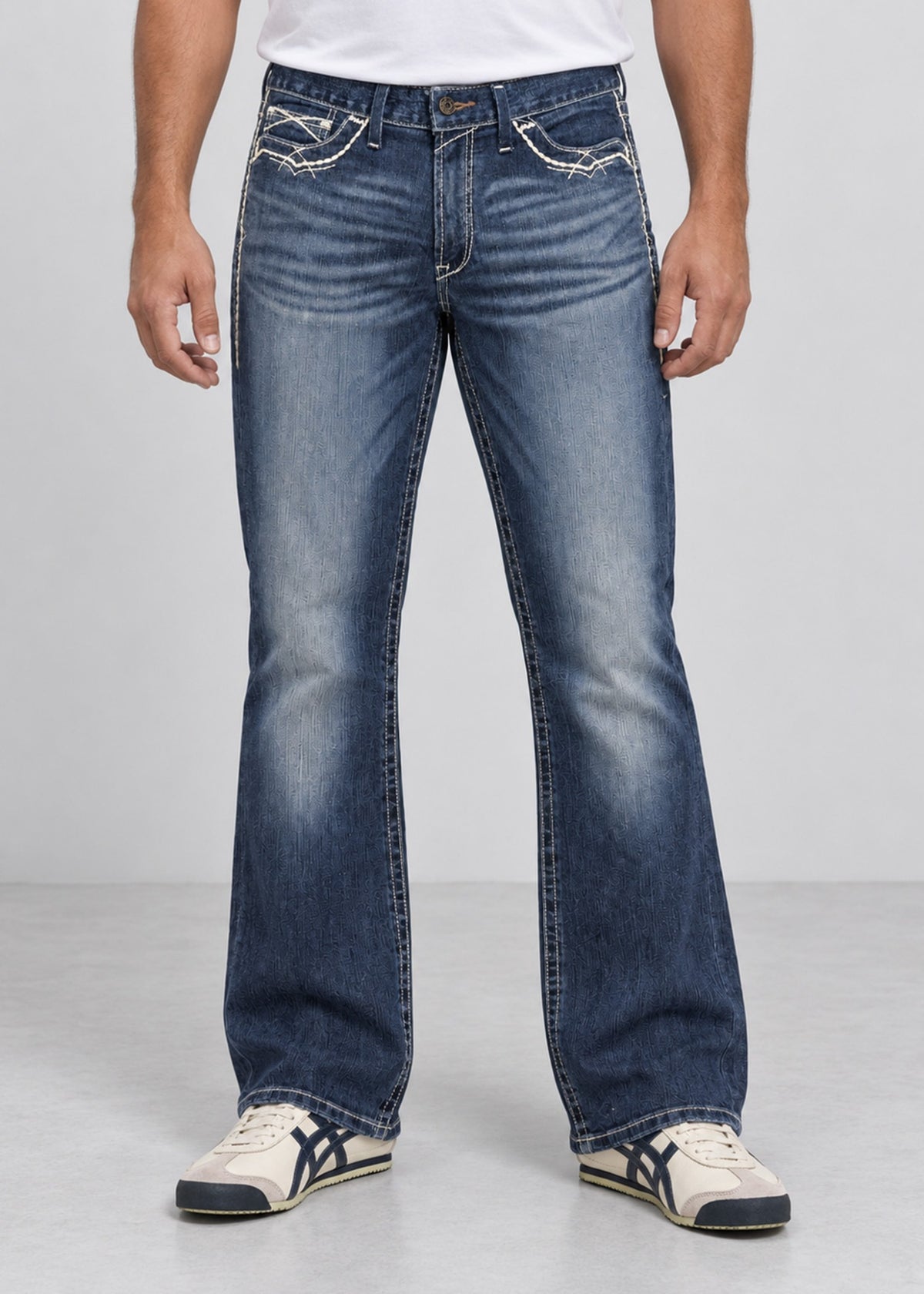 Blue wash bootcut jeans on male model, front view with contrast stitching
