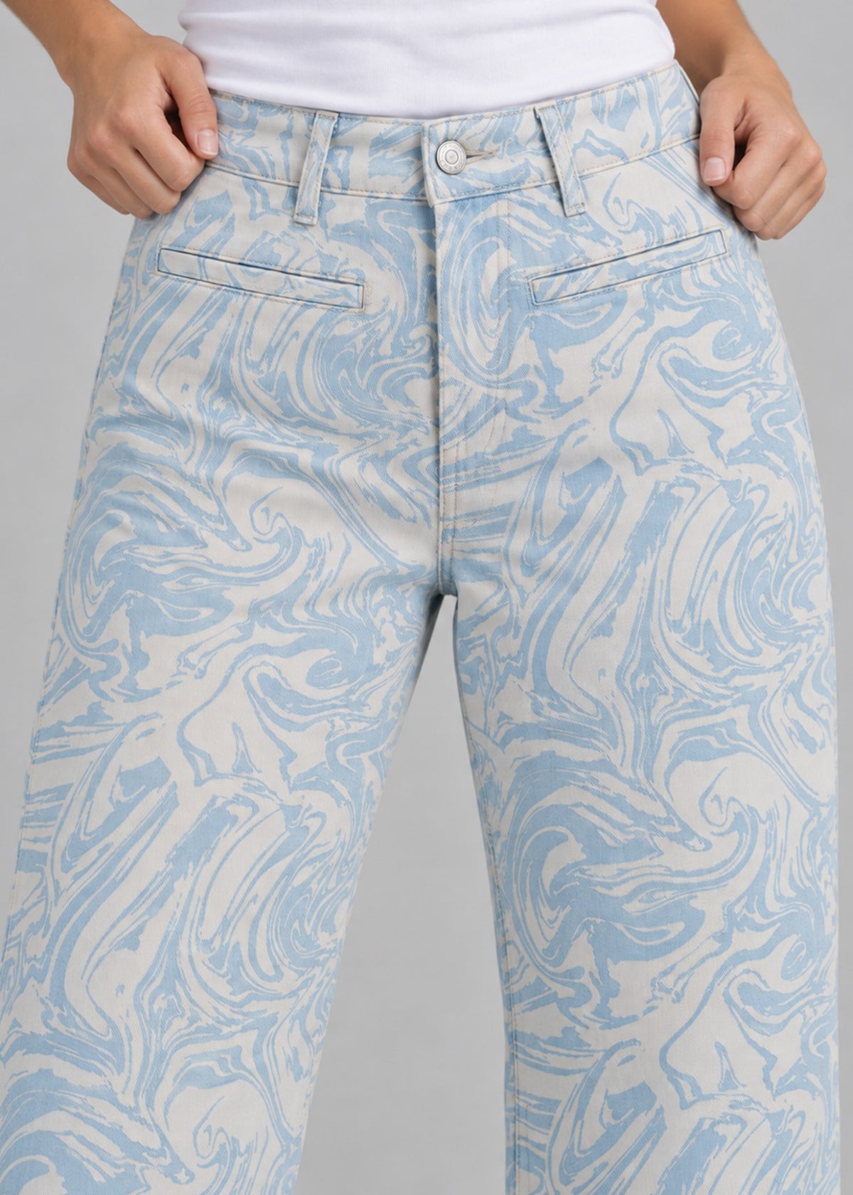 High Spirits blue marble print women's jeans, front waist and pockets close up
