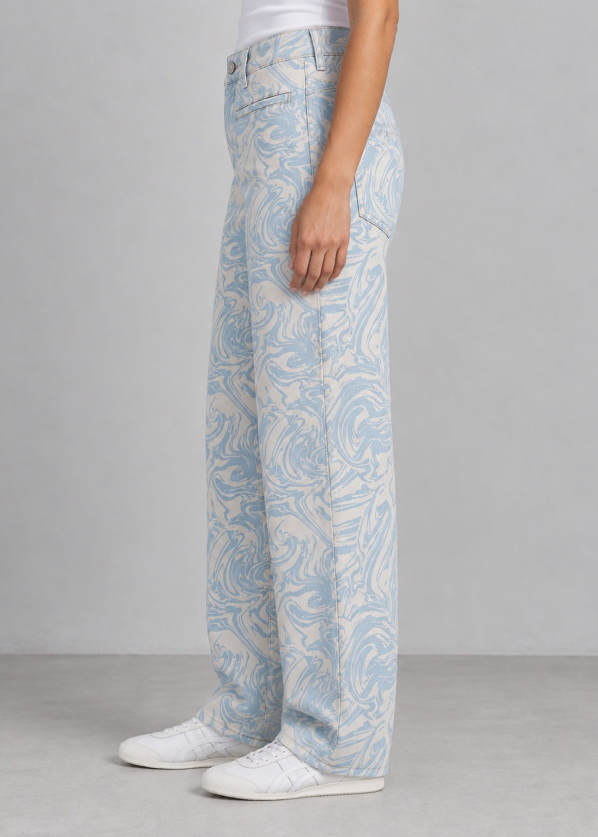 High Spirits blue marble print wide leg jeans worn by female model, side view