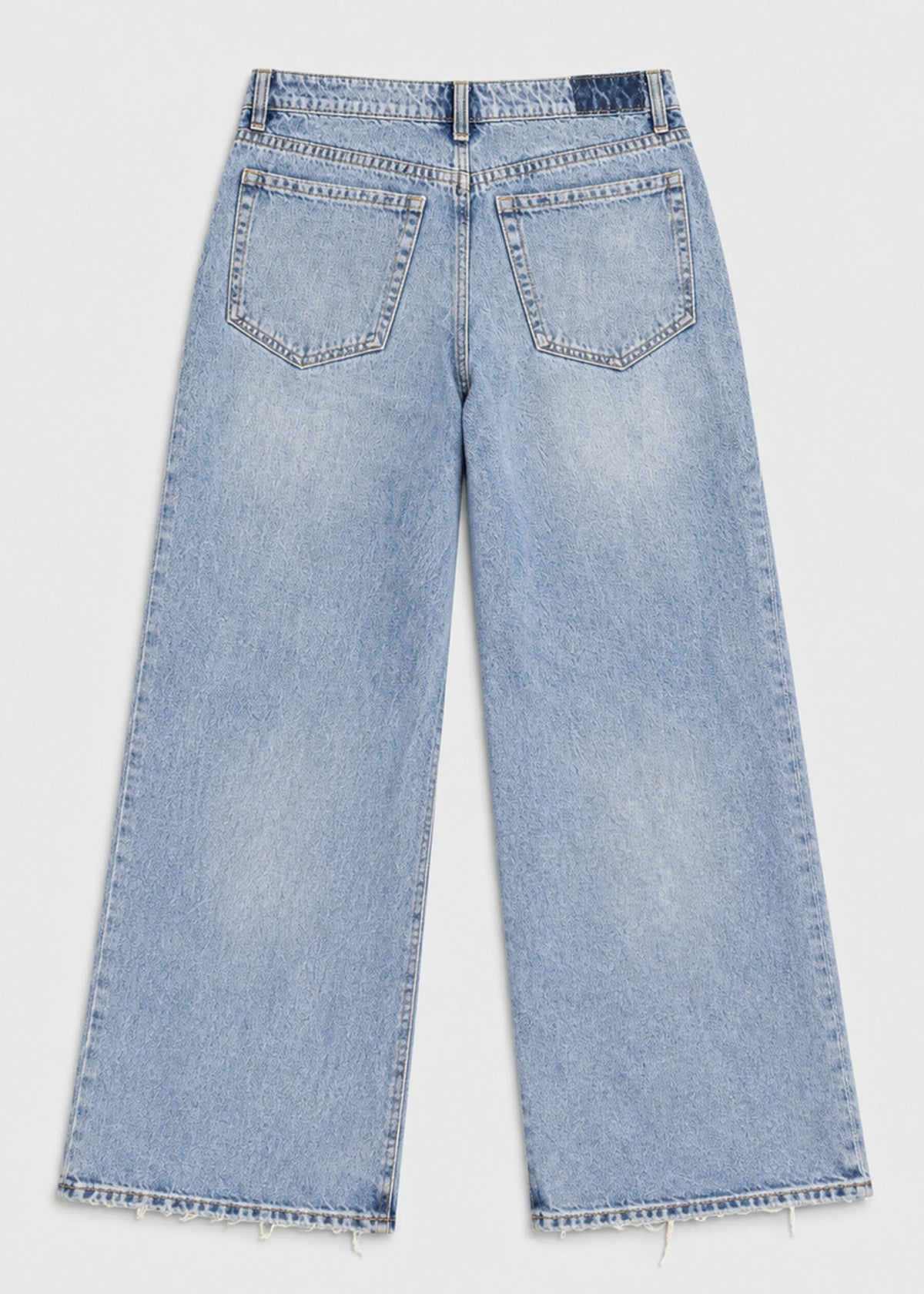 Hollister light wash wide leg jeans back flat lay with patch pockets and raw hem