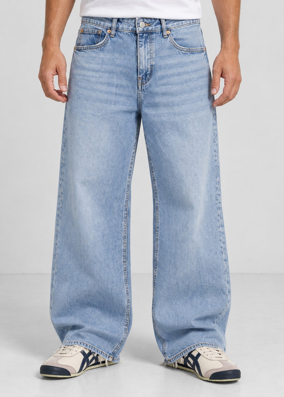Hollister light wash wide leg jeans on male model, front view