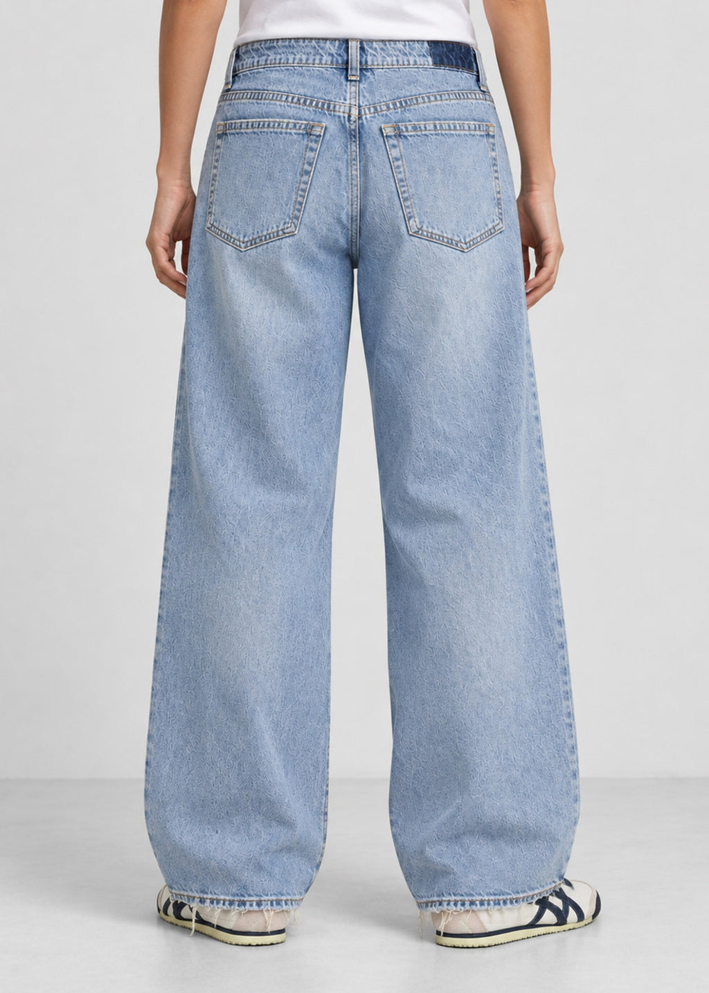 Hollister light wash wide leg jeans on female model, back view