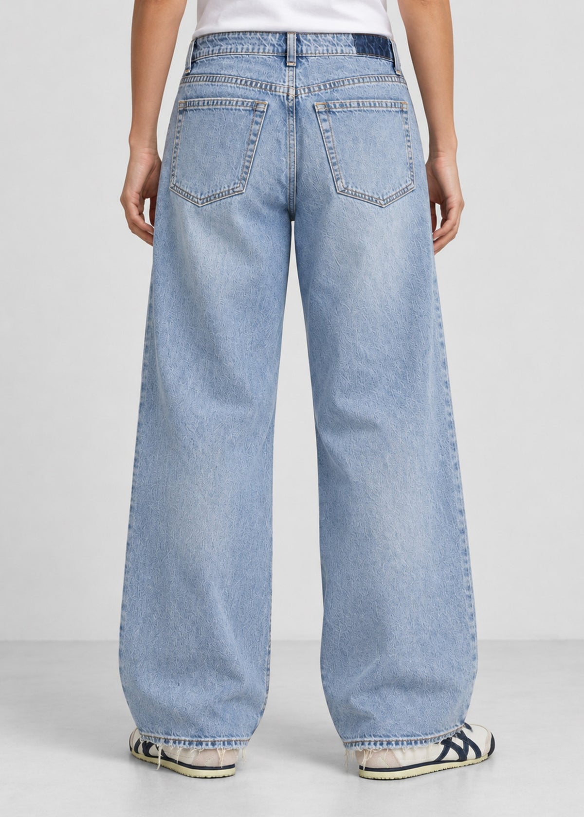 Hollister light wash wide leg jeans on female model, back view