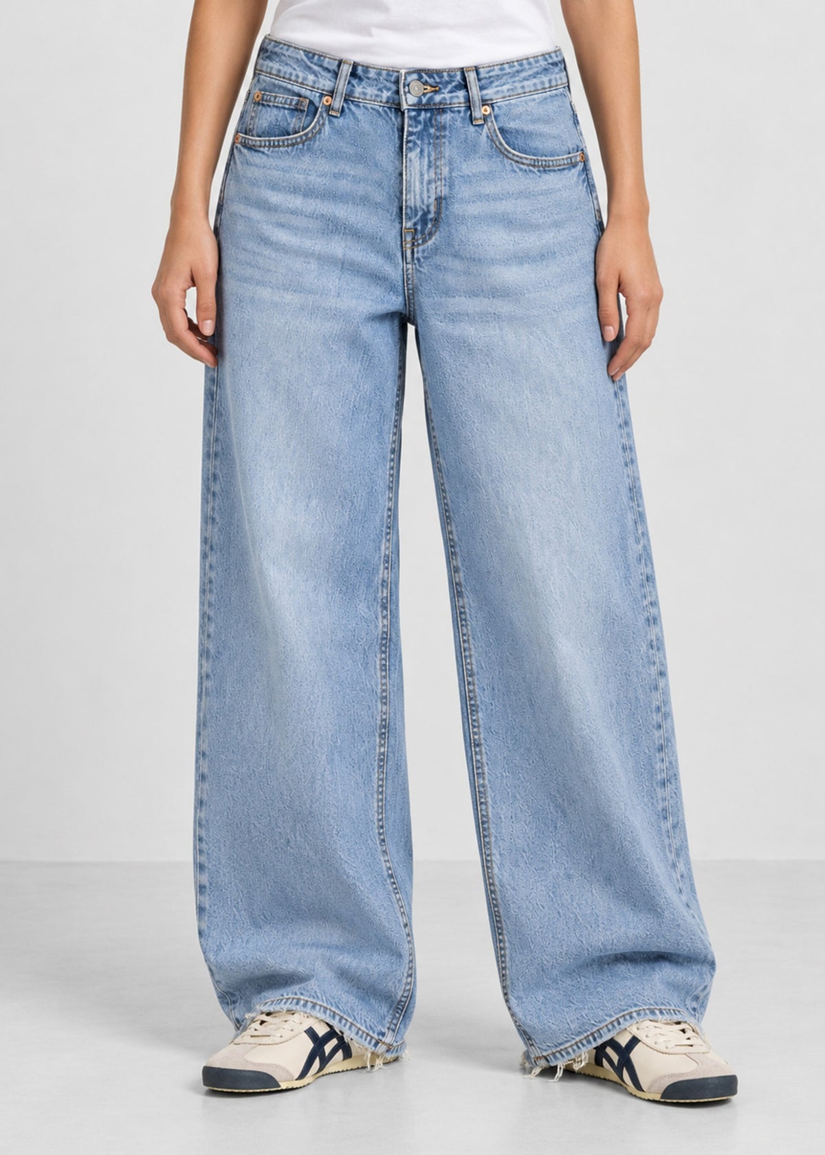 Hollister light wash wide leg jeans on female model, front view