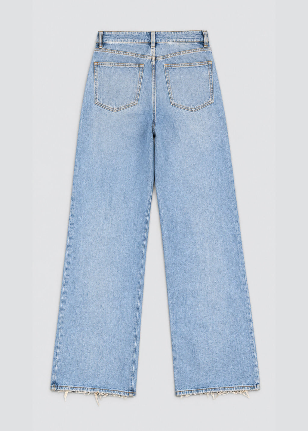 Light wash wide leg raw hem jeans back flat lay showing patch pockets