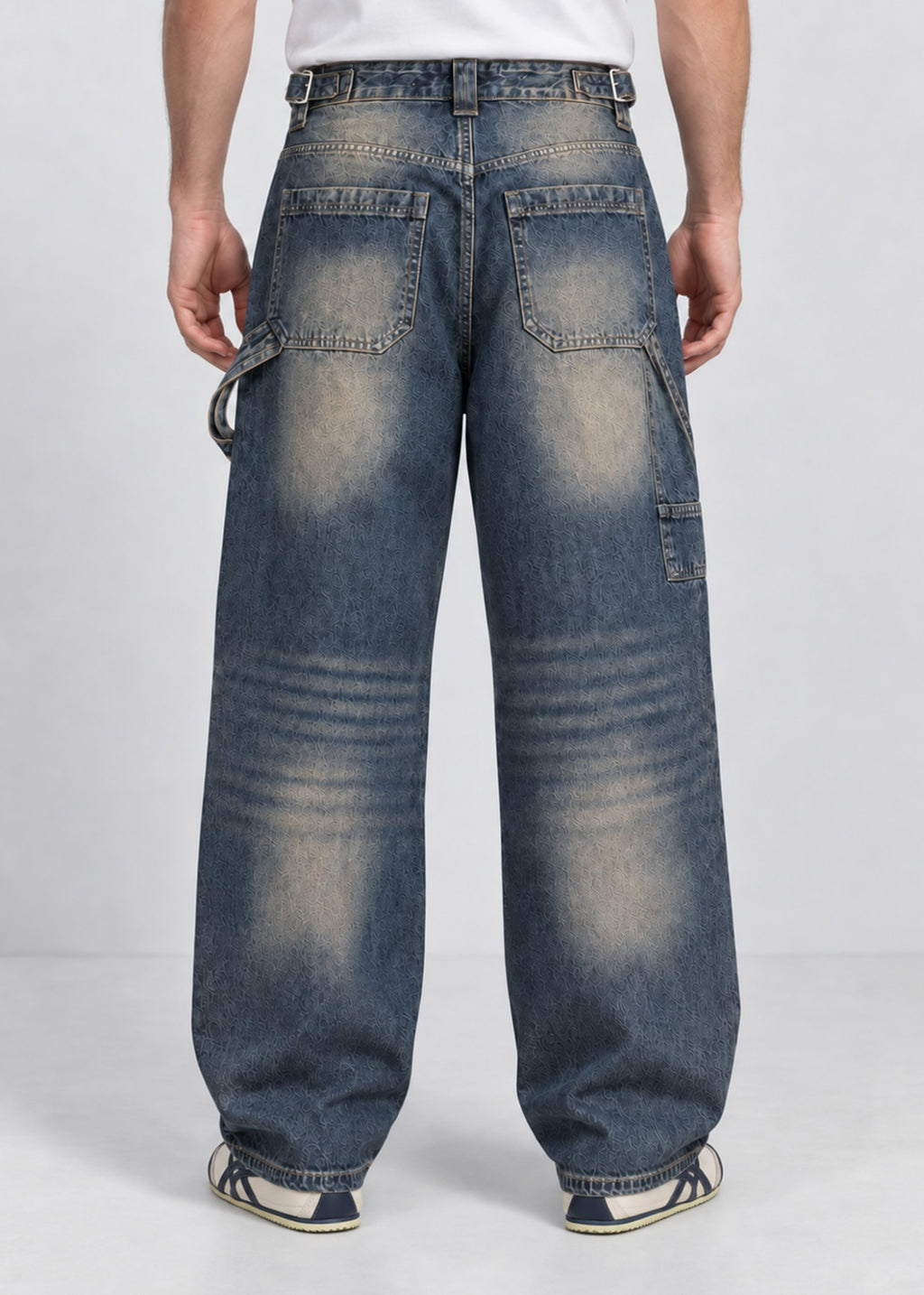 Unisex balloon fit utility jeans worn by male model, back view