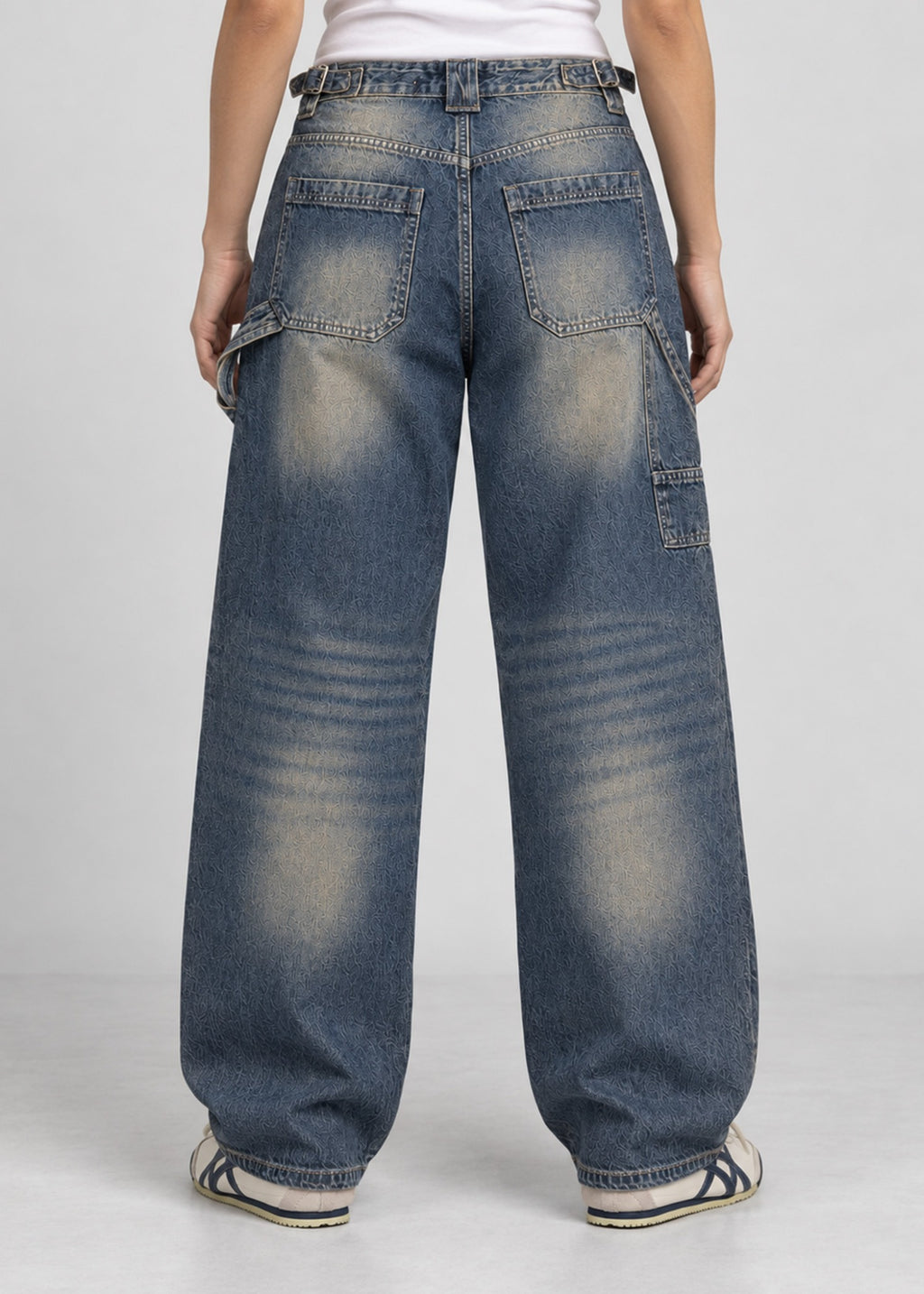 Unisex balloon fit utility jeans worn by female model, back view