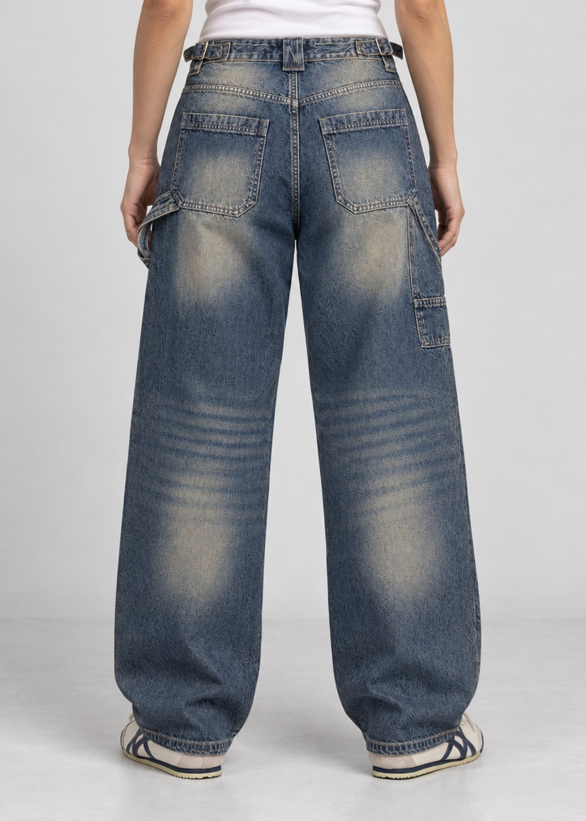 Unisex balloon fit utility jeans worn by female model, back view