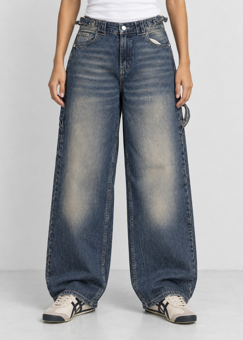Unisex balloon fit utility jeans worn by female model, front view
