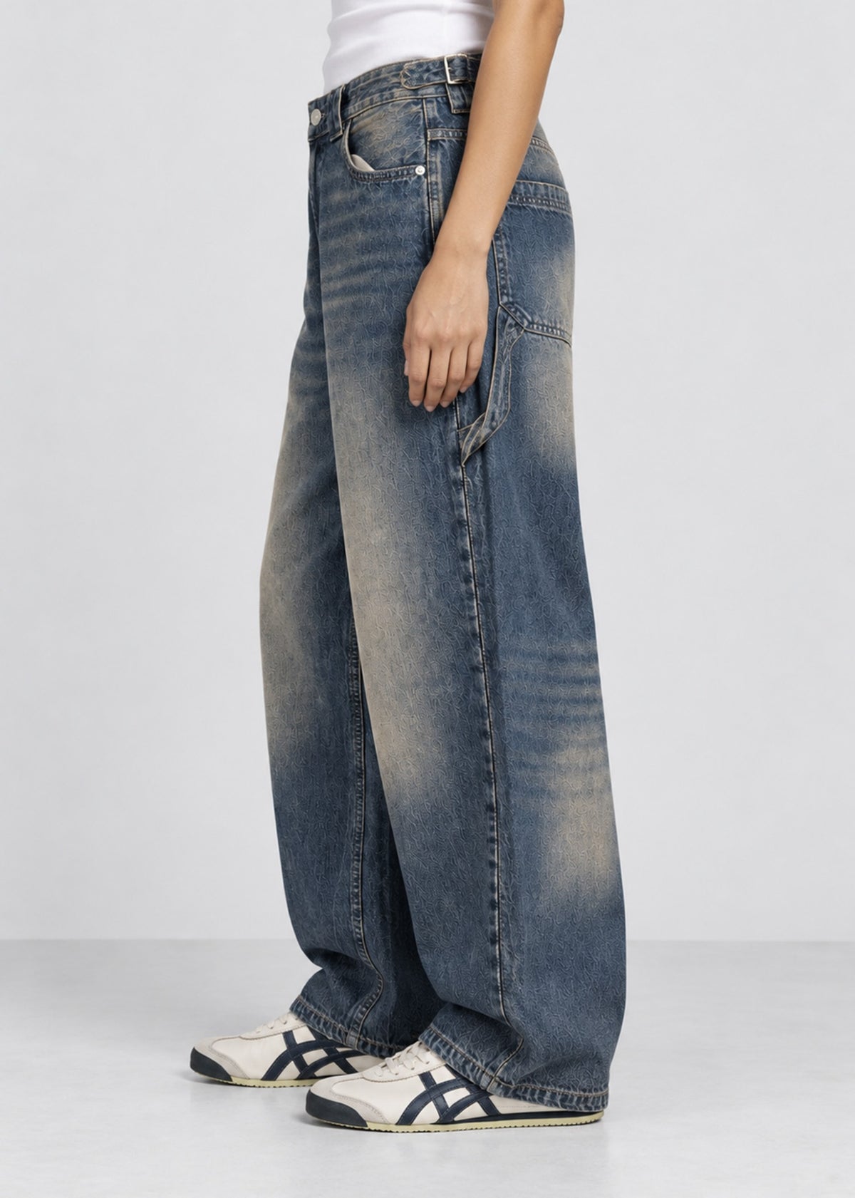 Unisex balloon fit utility jeans worn by female model, side view showing pocket