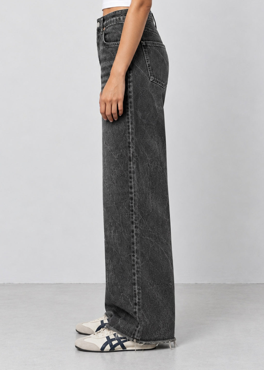 Unisex Zara charcoal acid wash wide leg jeans on female model, side view