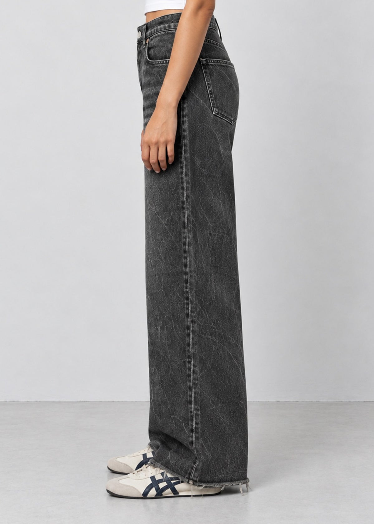 Unisex Zara charcoal acid wash wide leg jeans on female model, side view