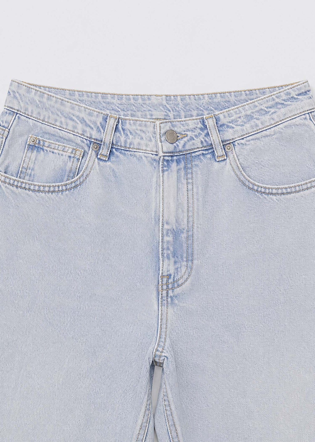Ultra-light-wash jeans waistband five-pocket and button detail