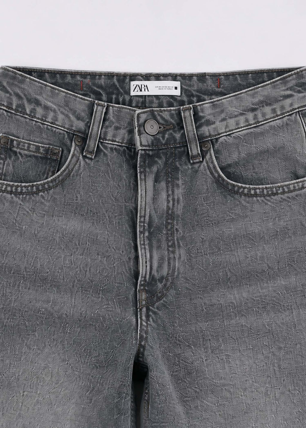 Zara grey acid-wash jeans waistband pocket and button detail