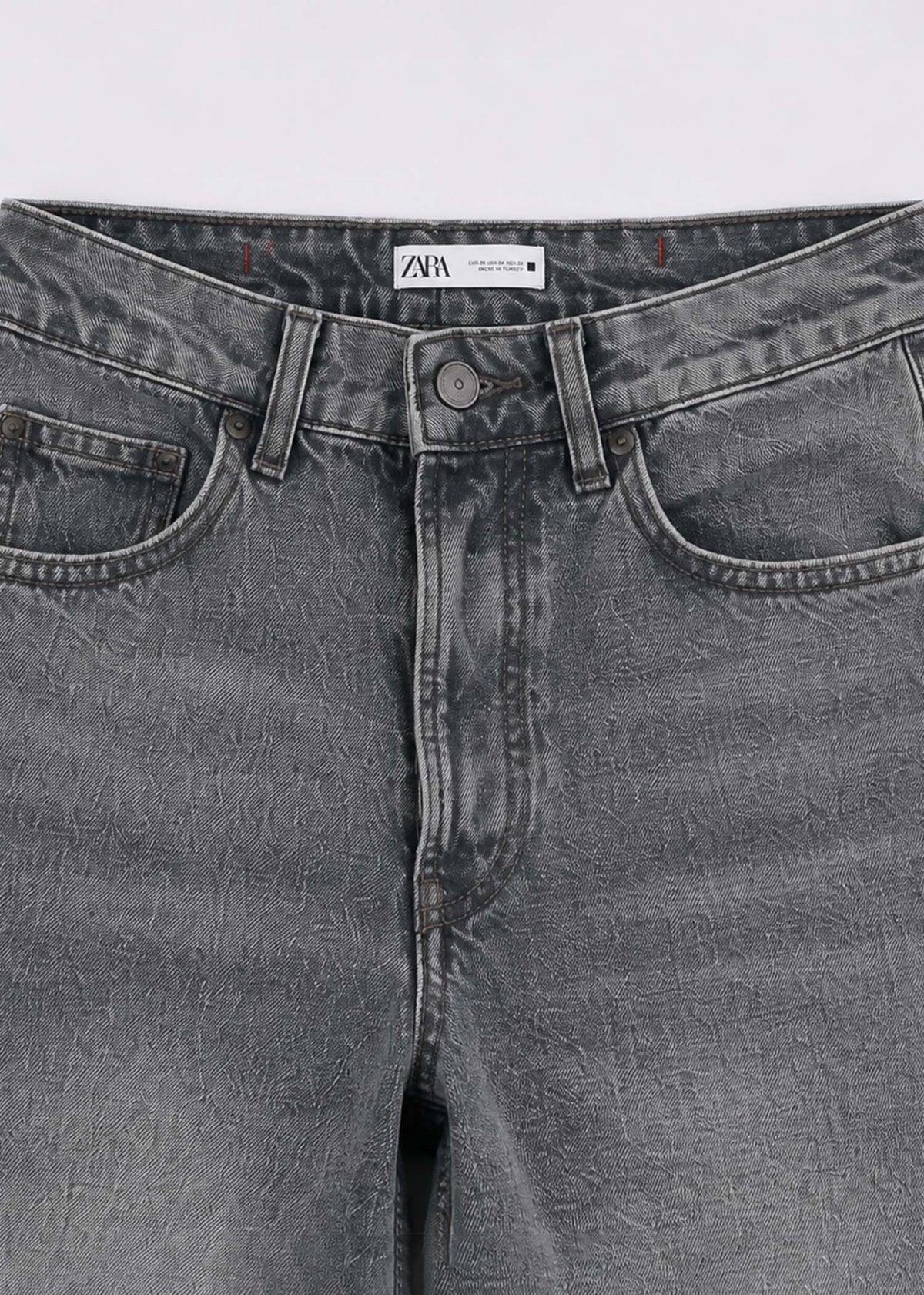 Zara grey acid-wash jeans waistband pocket and button detail
