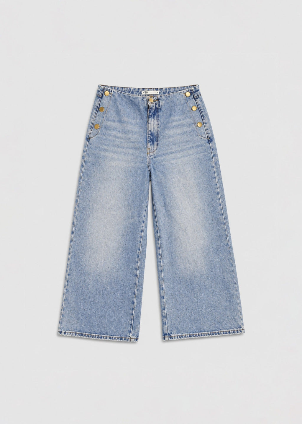 Zara light acid-wash wide-leg jeans front view with gold buttons