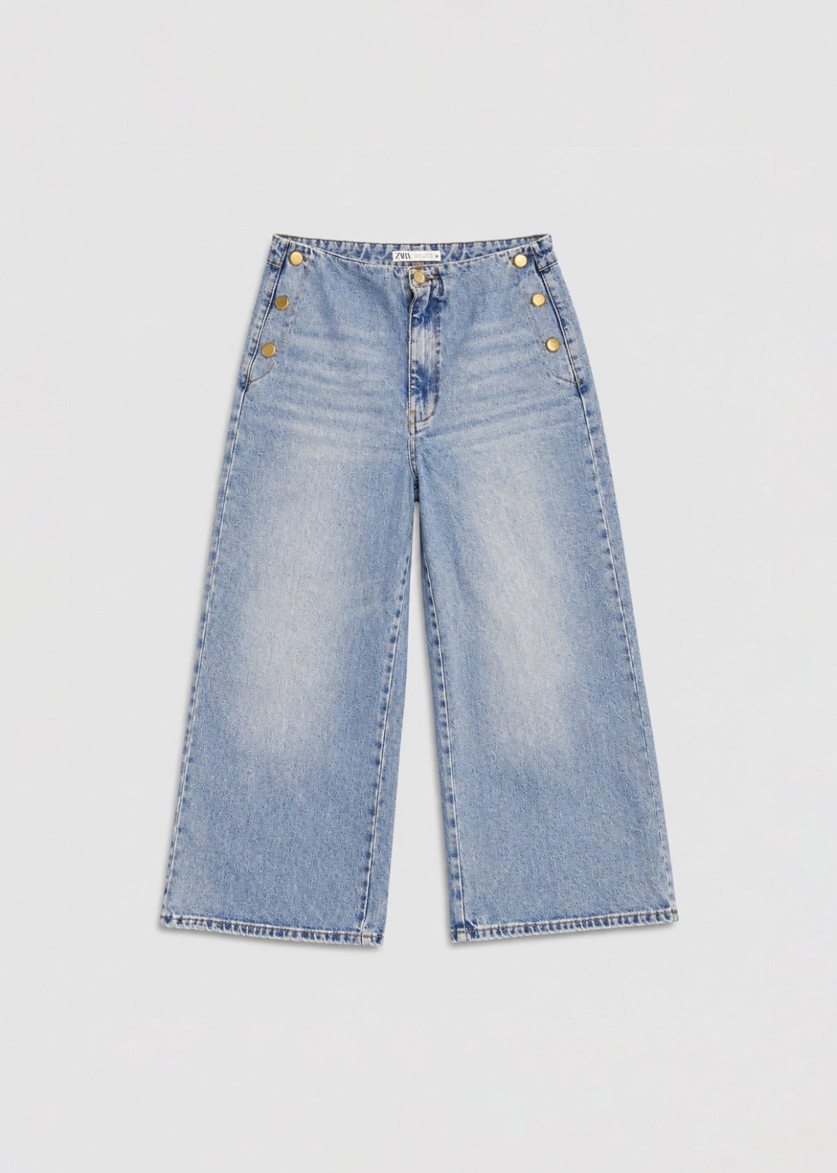 Zara light acid-wash wide-leg jeans front view with gold buttons
