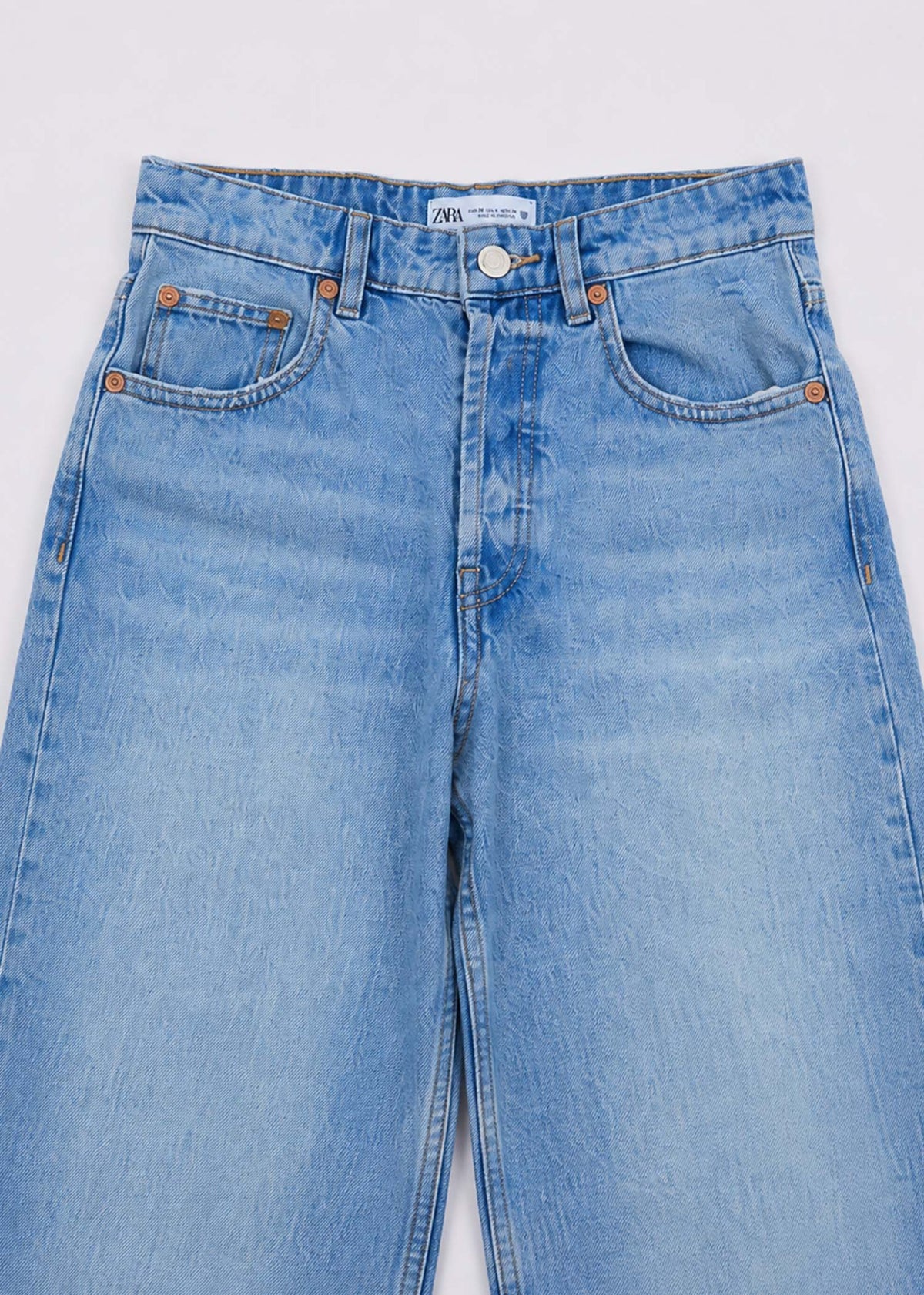Zara light-wash jeans waistband five-pocket and button detail