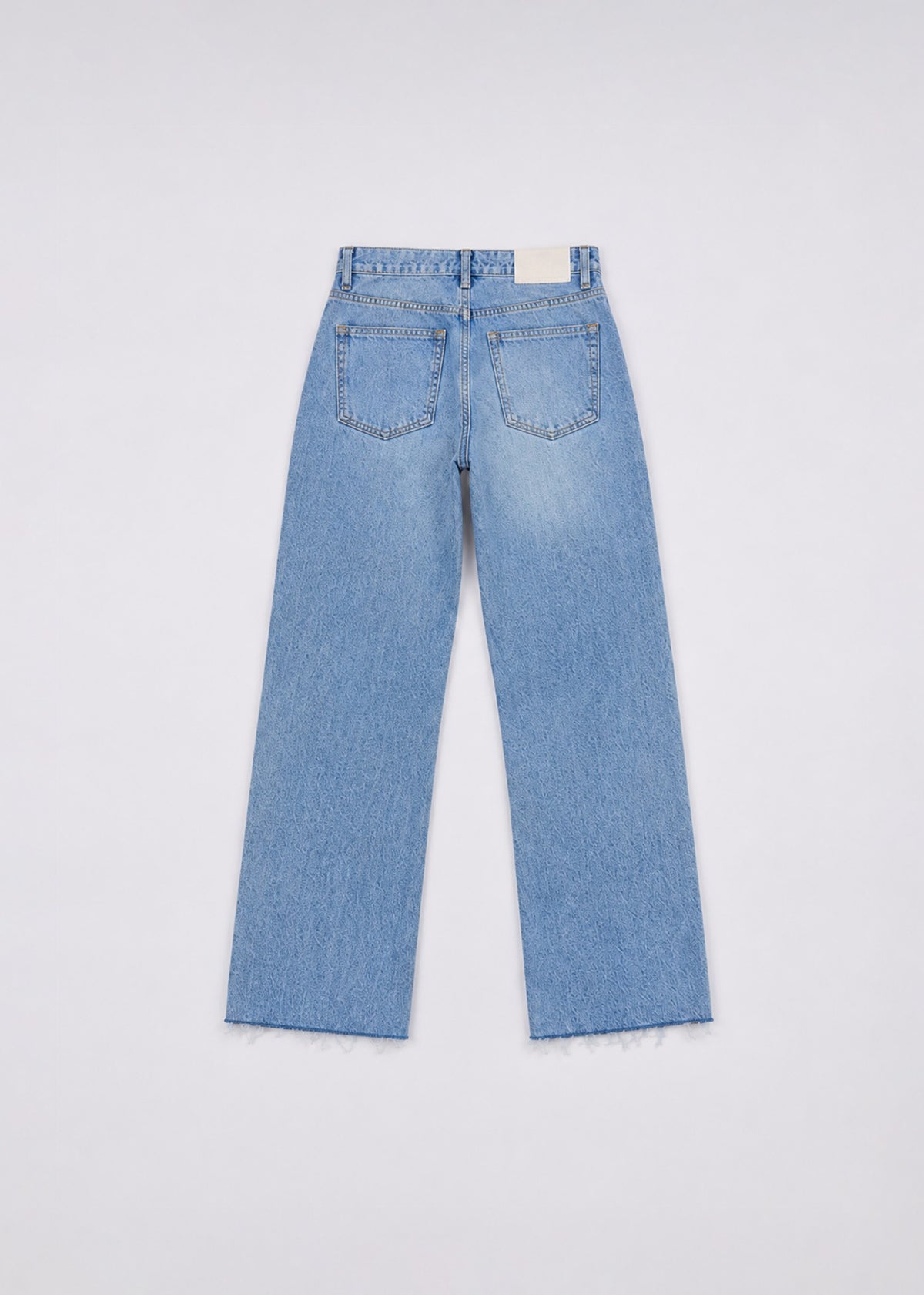 Zara light-wash wide-leg jeans back view with patch pockets