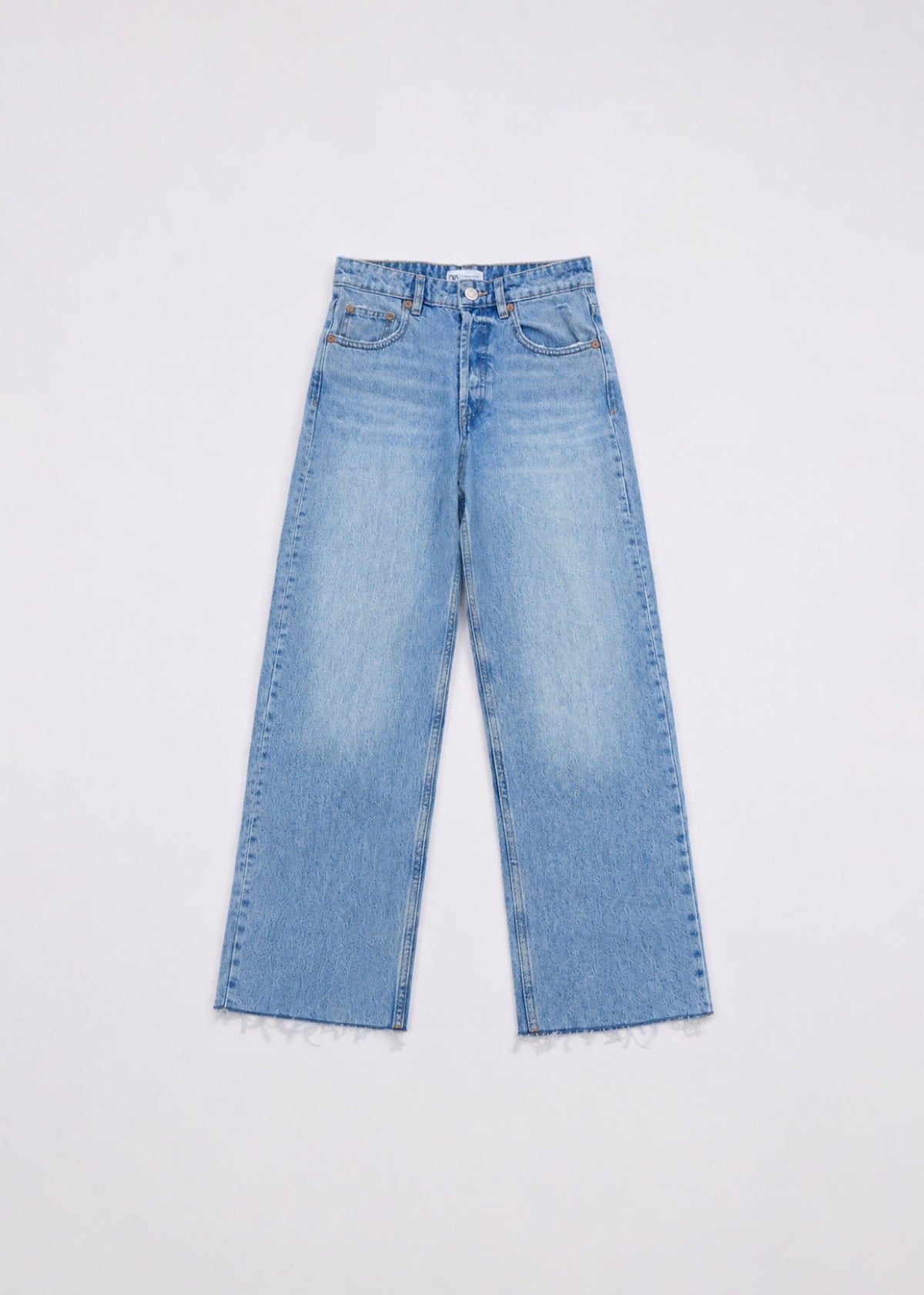 Zara light-wash wide-leg jeans front view with raw frayed hem