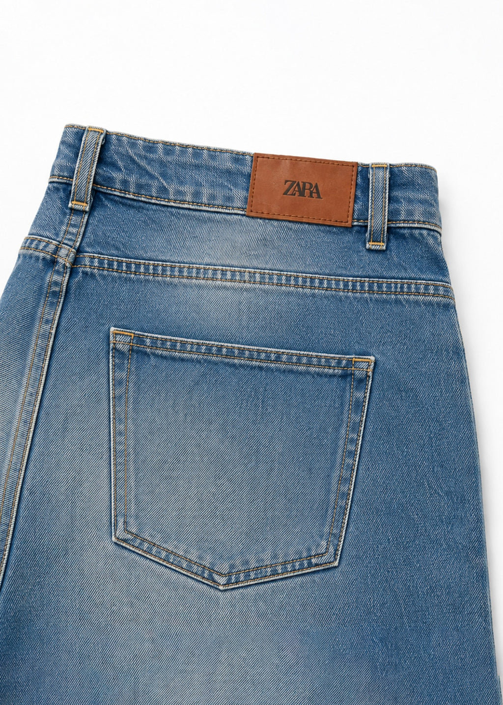 Zara medium-wash jeans brown back logo patch and pocket detail