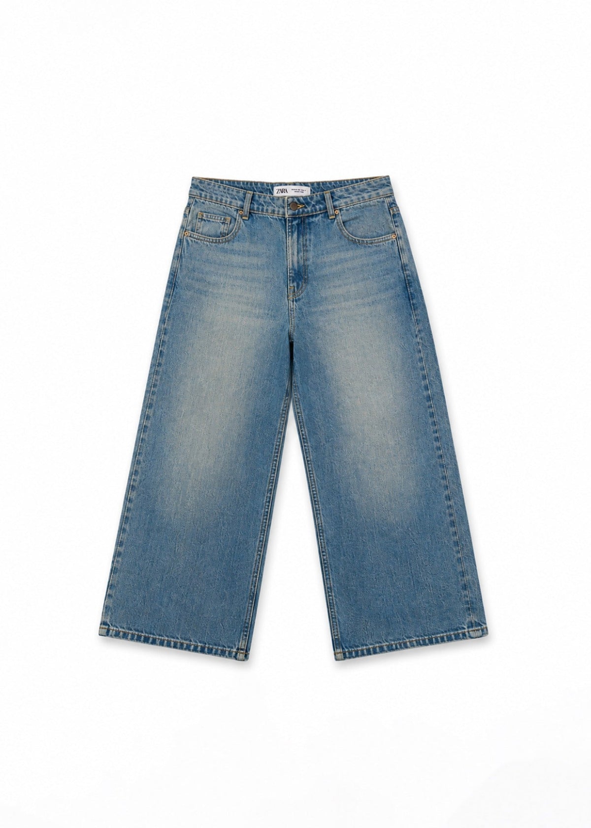 Zara medium-wash wide-leg jeans front view with faded detailing